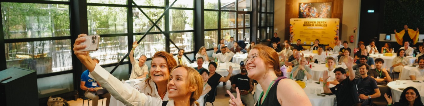 Guests taking a selfie at an Agentic Day summit